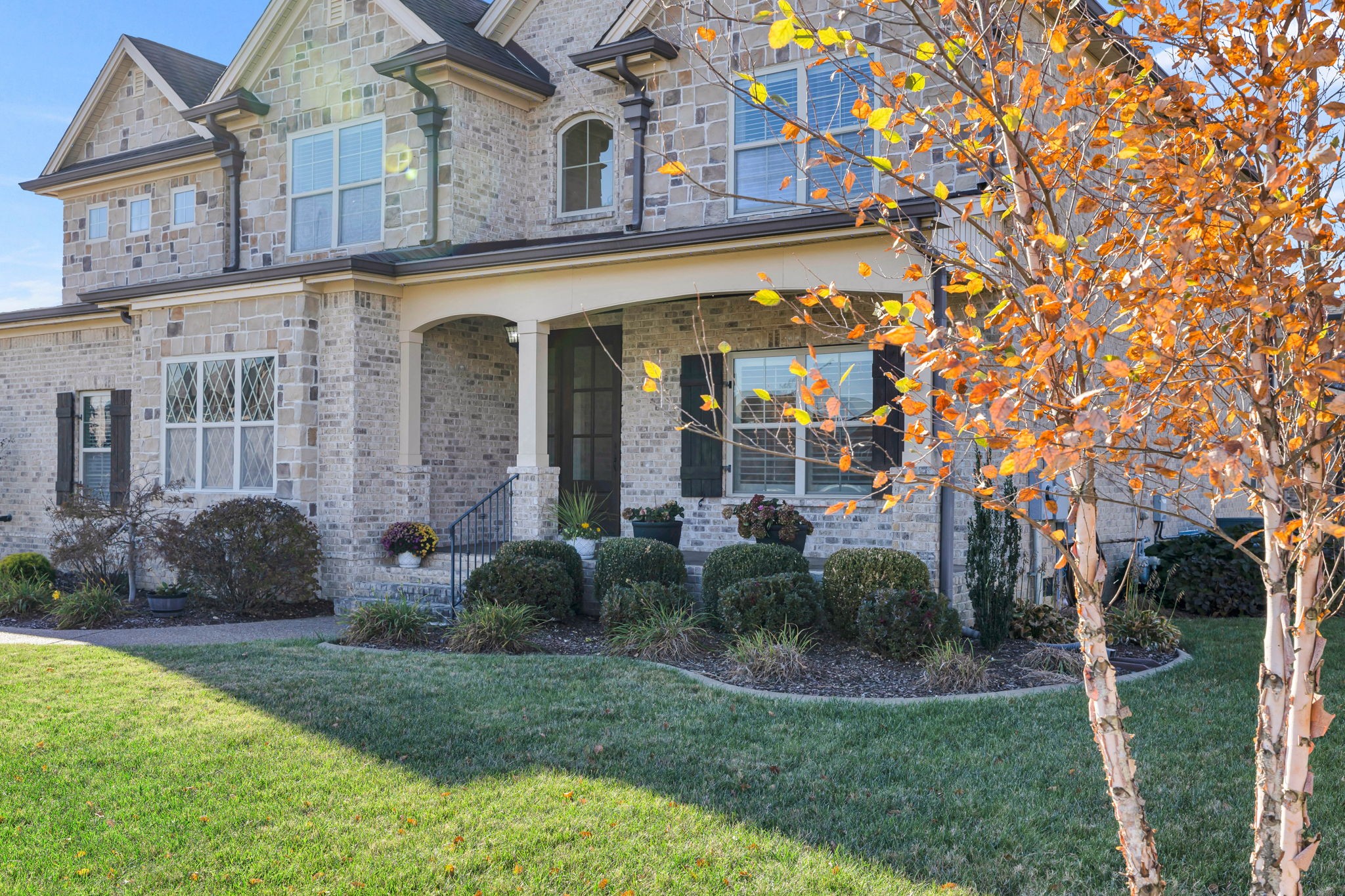 2065 Autumn Ridge Way Spring Hill, TN 37174 - Photo 2 of 58 a view of a house with brick walls and a yard with plants