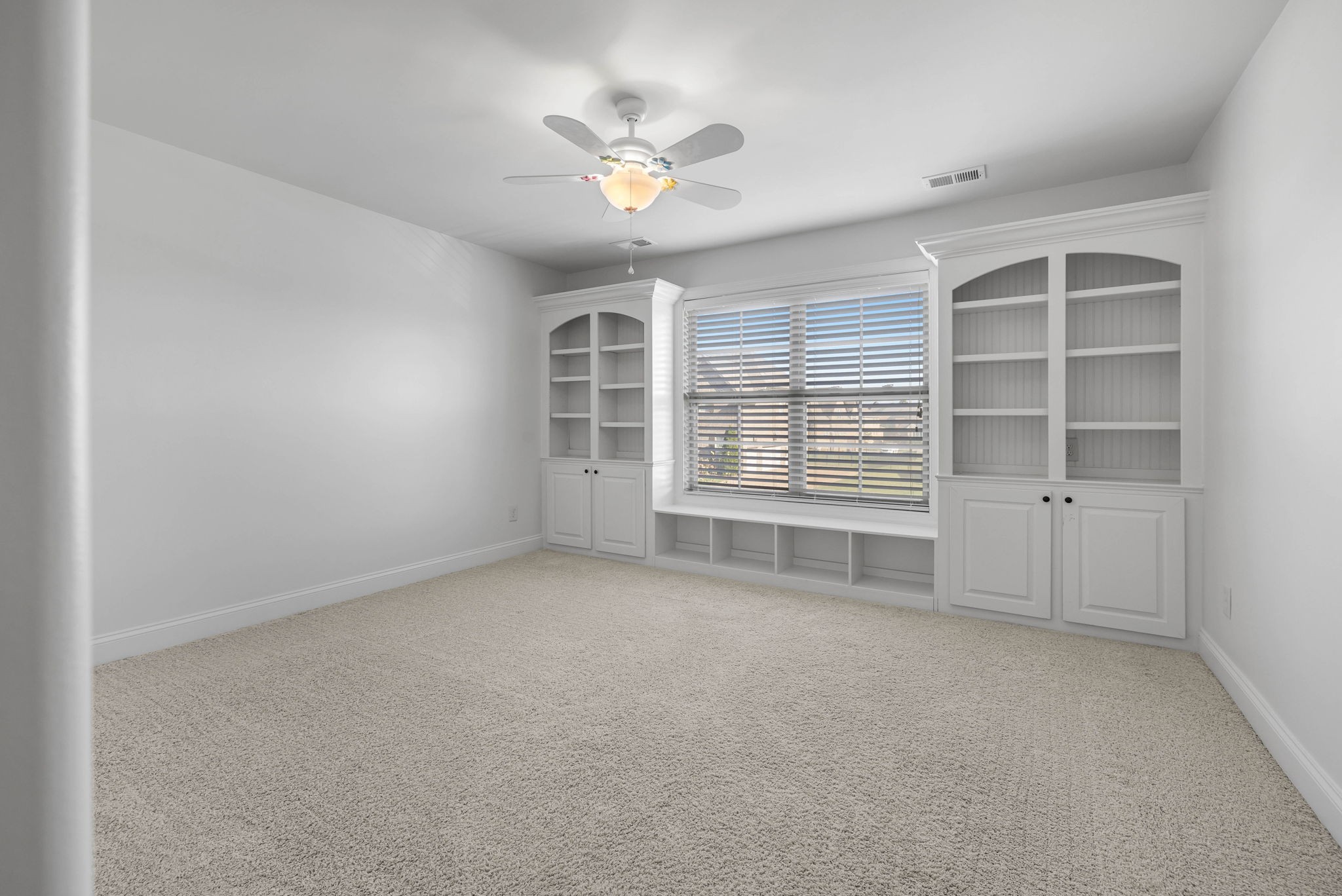 2065 Autumn Ridge Way Spring Hill, TN 37174 - Photo 50 of 58 an empty room with windows and chandelier fan