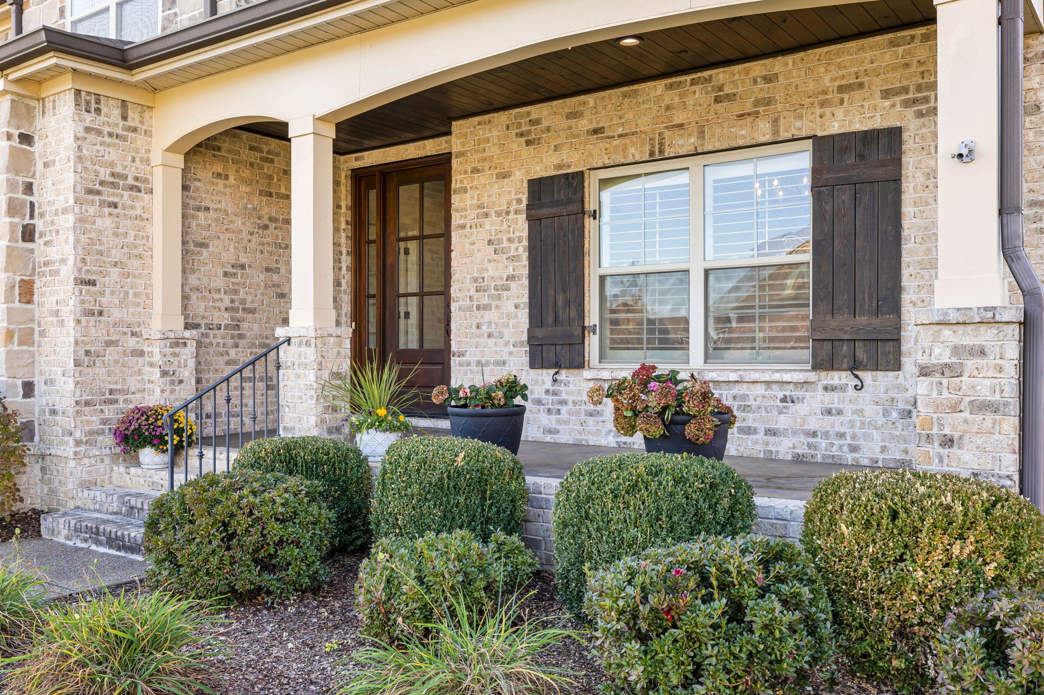 2065 Autumn Ridge Way Spring Hill, TN 37174 - Photo 5 of 58 a front view of a house with outdoor seating and plants