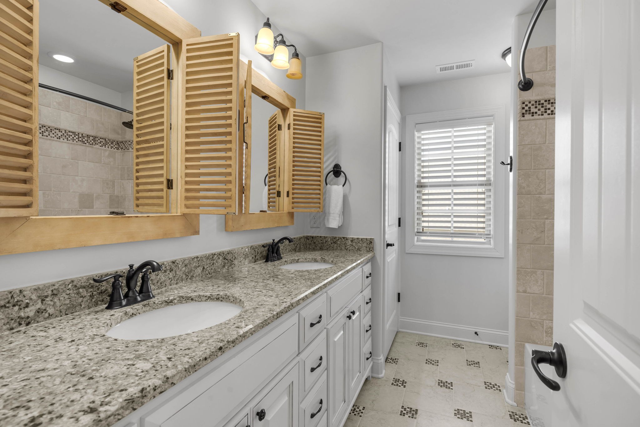 2065 Autumn Ridge Way Spring Hill, TN 37174 - Photo 51 of 58 a bathroom with a granite countertop sink and a mirror