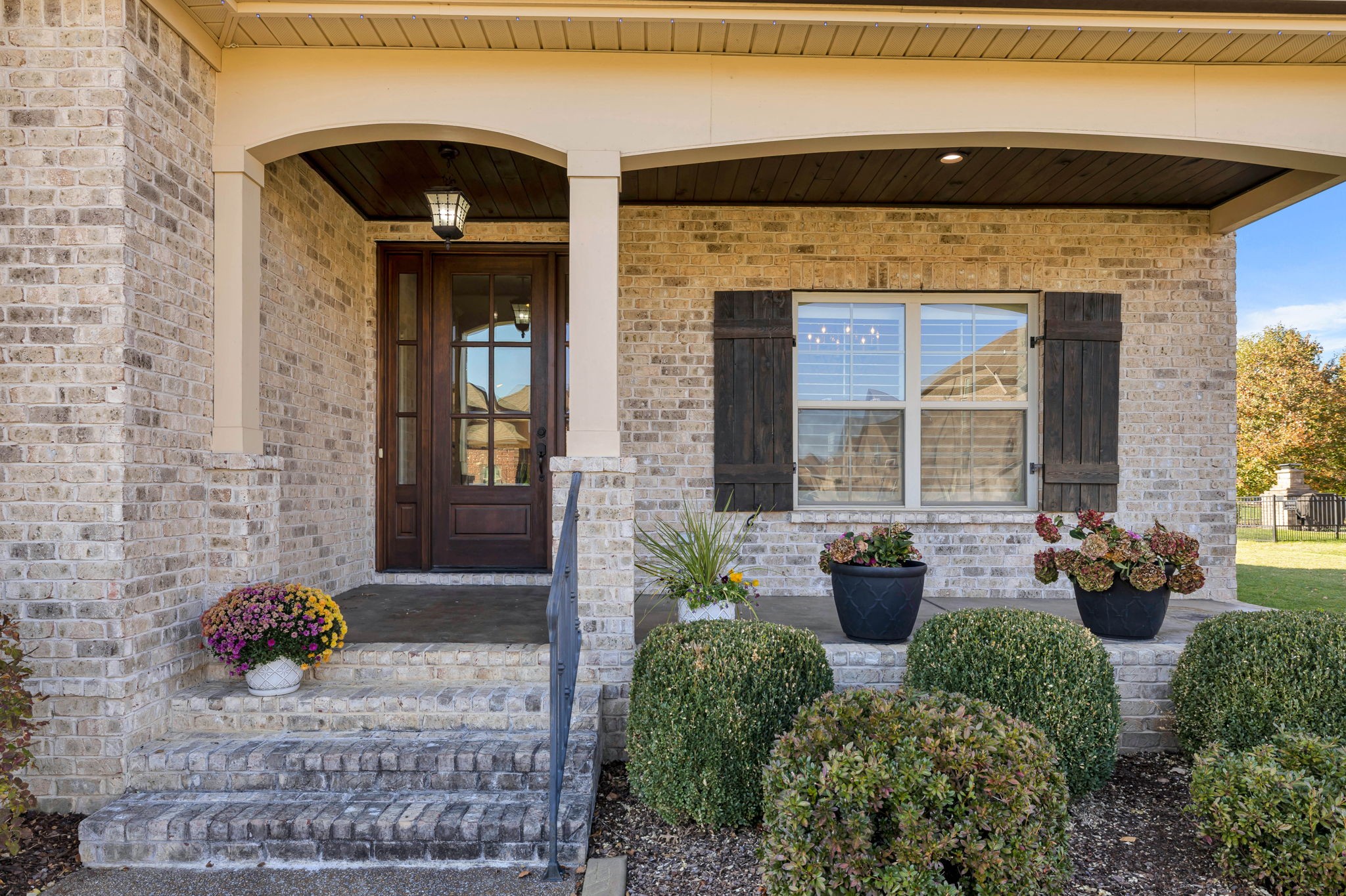 2065 Autumn Ridge Way Spring Hill, TN 37174 - Photo 6 of 58 a front view of a house with outdoor seating and plants
