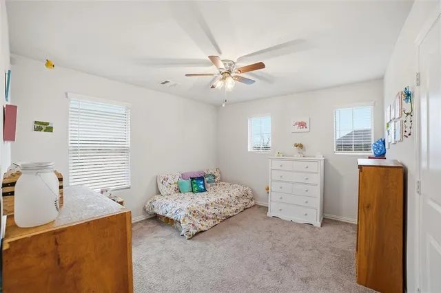 a bedroom with a bed and furniture