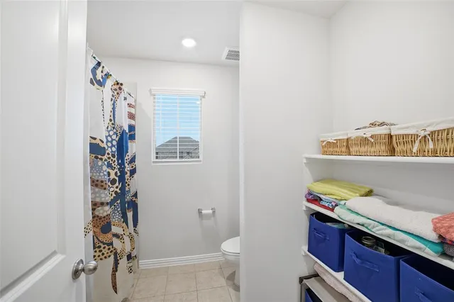 a bathroom with a tub sink and toilet