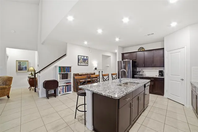 a kitchen with a stove a refrigerator and a refrigerator