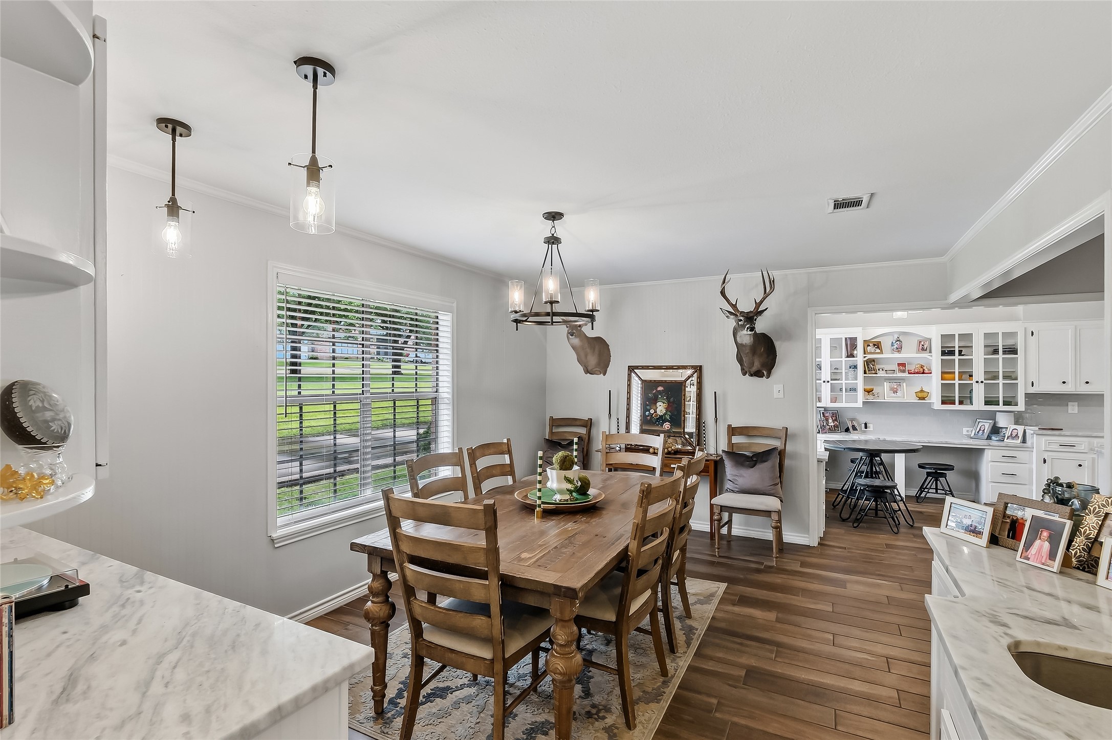 906 Standley Road Madisonville, TX 77864 - Photo 12 of 40 a view of a dining room with furniture window and wooden floor