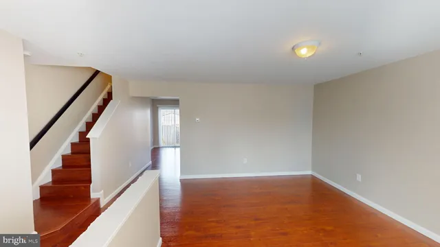 a view of an empty room with stairs