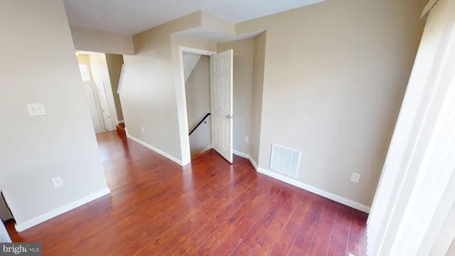 a kitchen with white cabinets and a sink