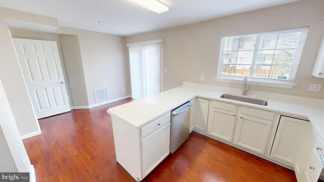a view of hallway with wooden floor