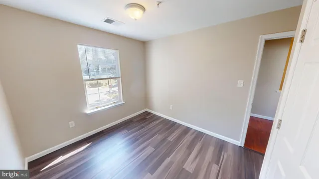 a view of a hallway with a white door