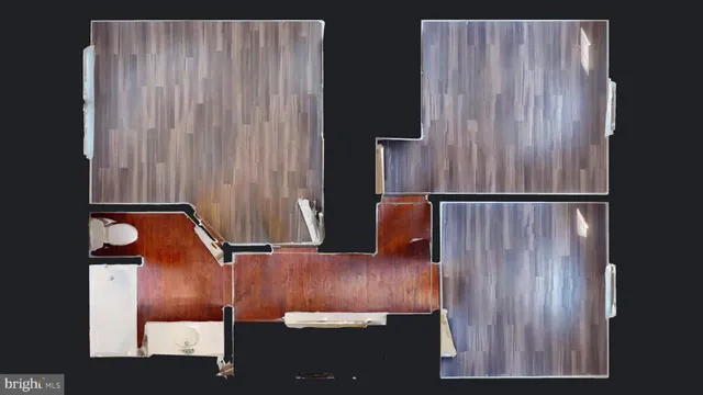 a view of a room with wooden floor and window