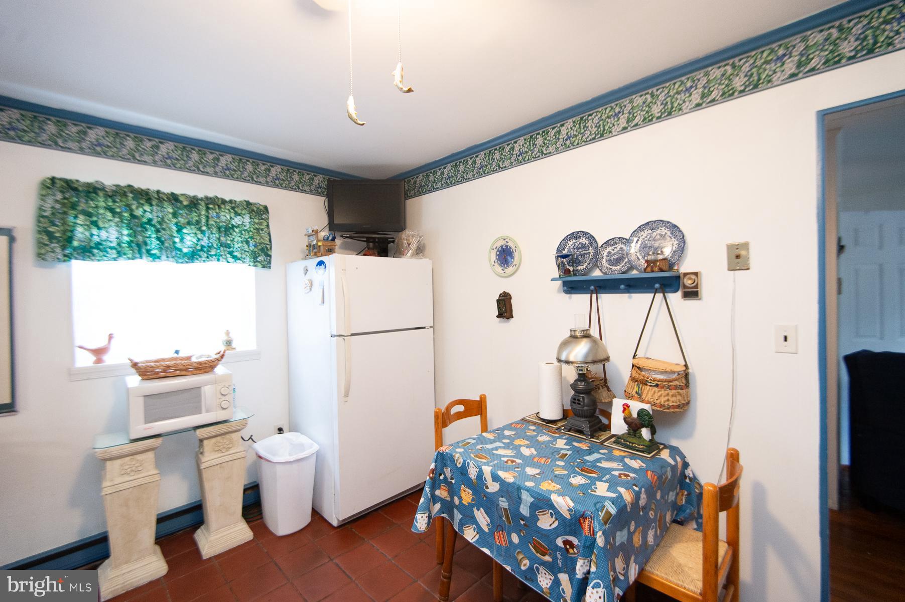 819 Seabreeze Road Cambridge, MD 21613 - Photo 11 of 31 a bedroom with a bed and a table