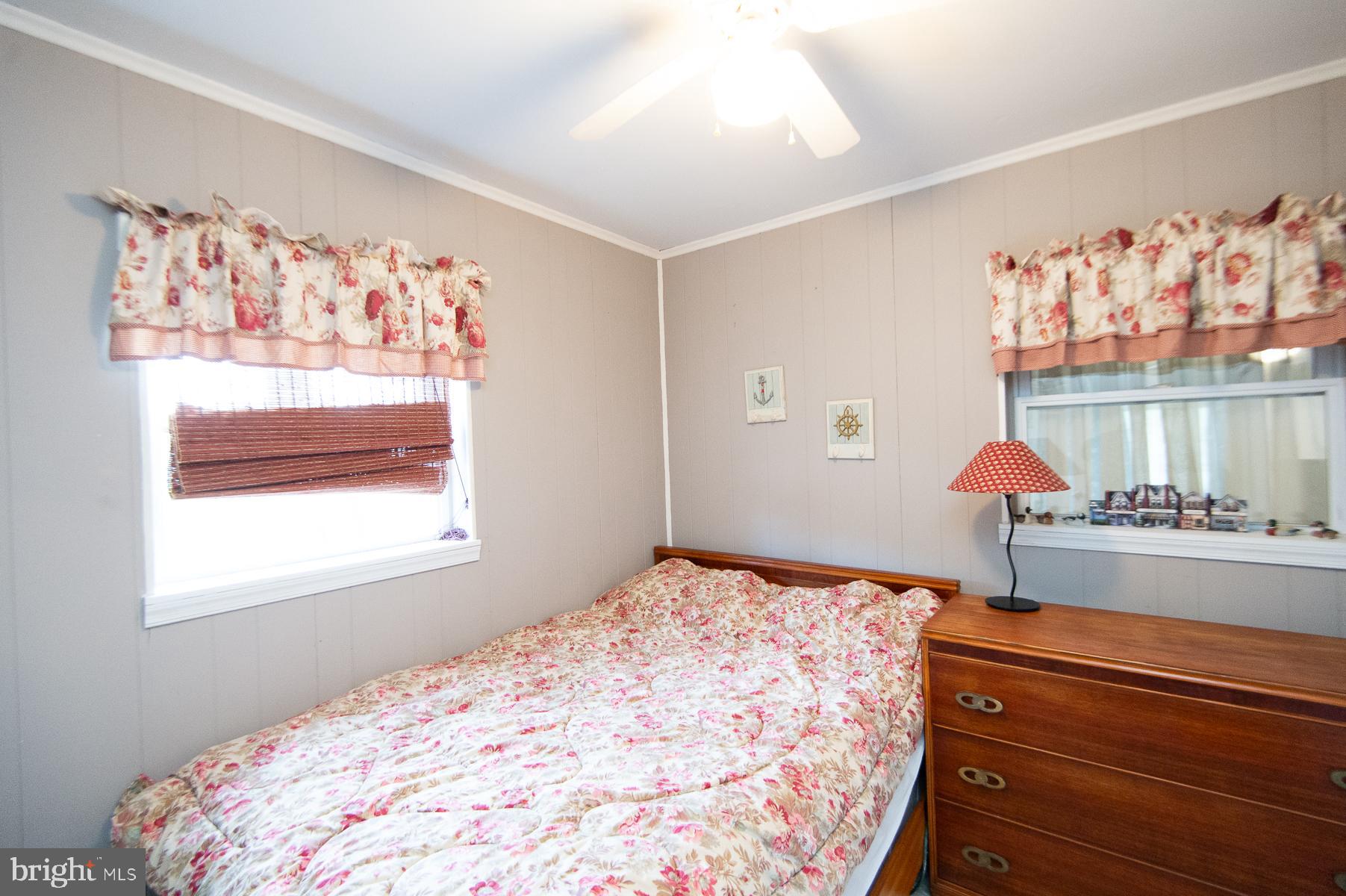 819 Seabreeze Road Cambridge, MD 21613 - Photo 12 of 31 a bedroom with a bed and a window