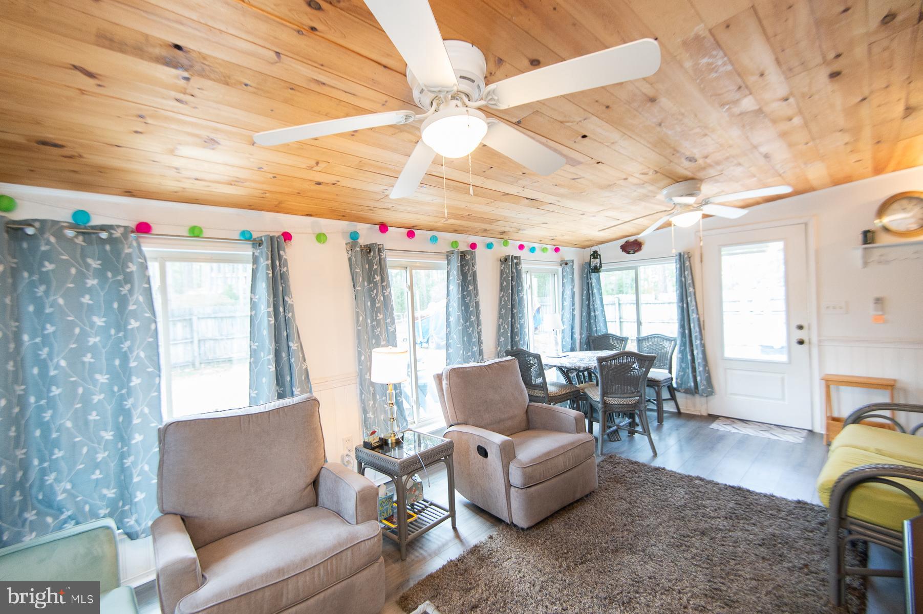 819 Seabreeze Road Cambridge, MD 21613 - Photo 17 of 31 a living room with furniture and a large window