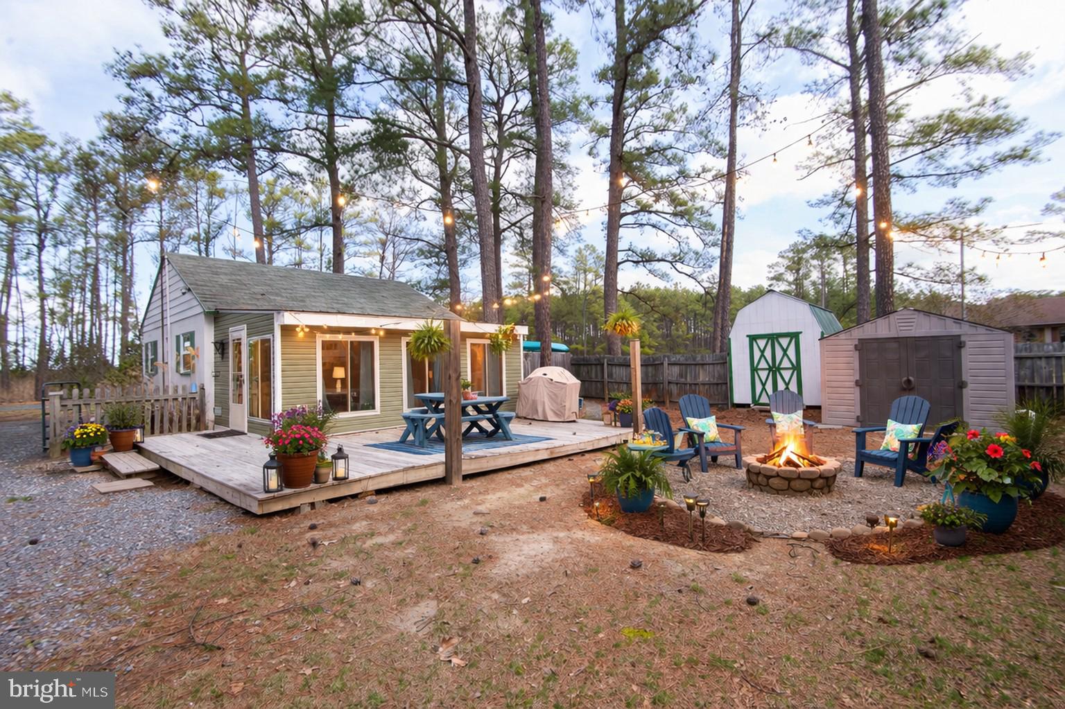 819 Seabreeze Road Cambridge, MD 21613 - Photo 21 of 31 a view of a backyard with a sitting area and slide