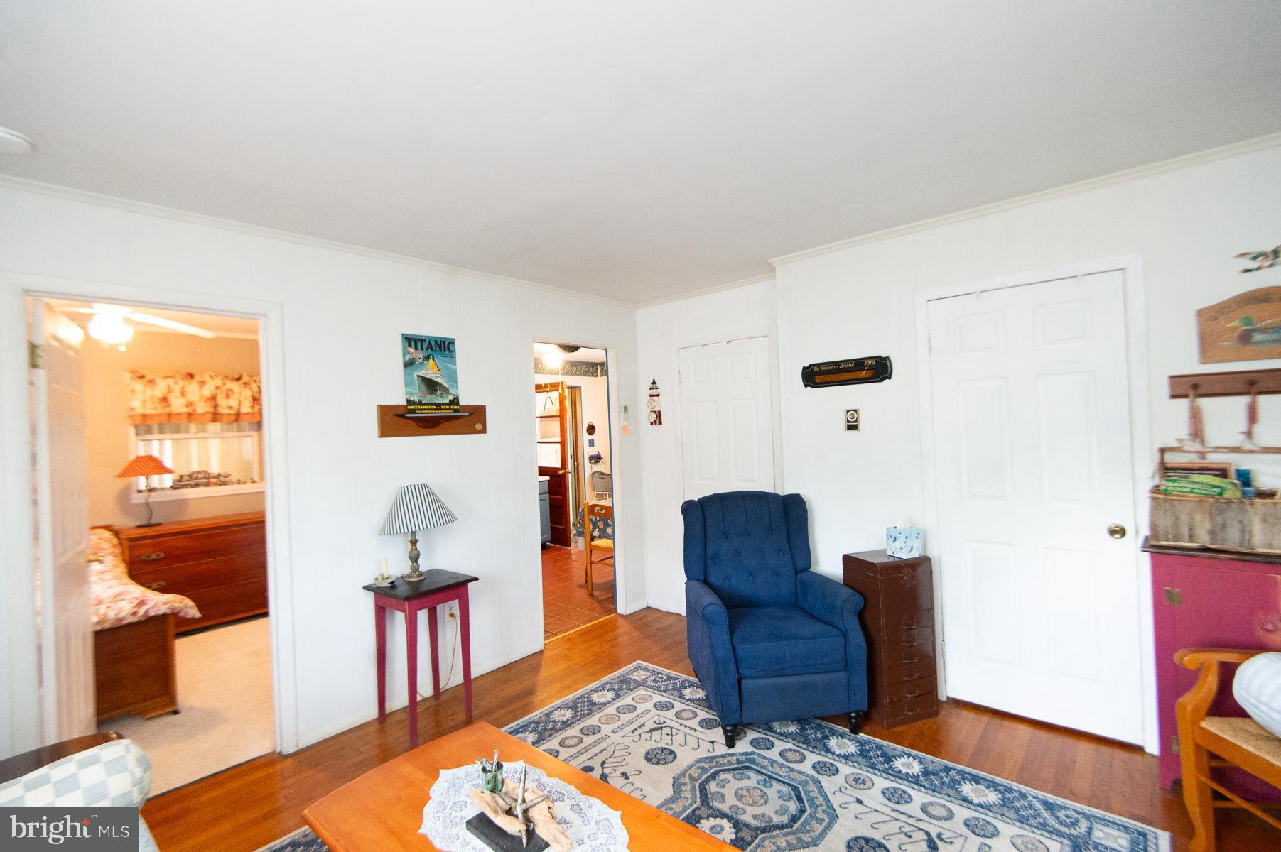 819 Seabreeze Road Cambridge, MD 21613 - Photo 5 of 31 a living room with furniture and wooden floor