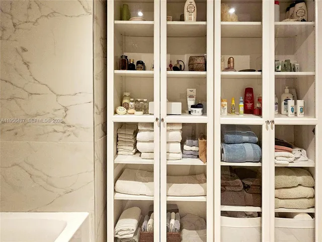 a bedroom with a bed and a mirror