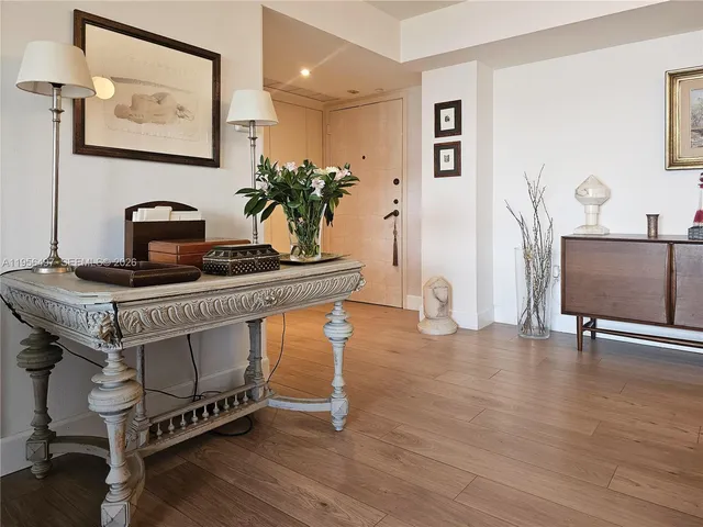 a view of a hallway with seating area