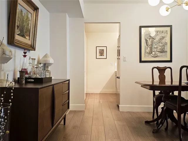 a kitchen with stainless steel appliances a refrigerator sink and microwave