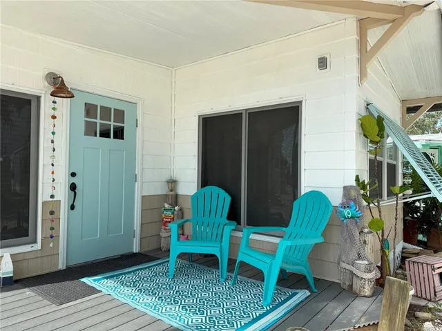 a view of a room that has a table and chairs in it