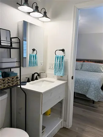 a bathroom with a sink and a mirror