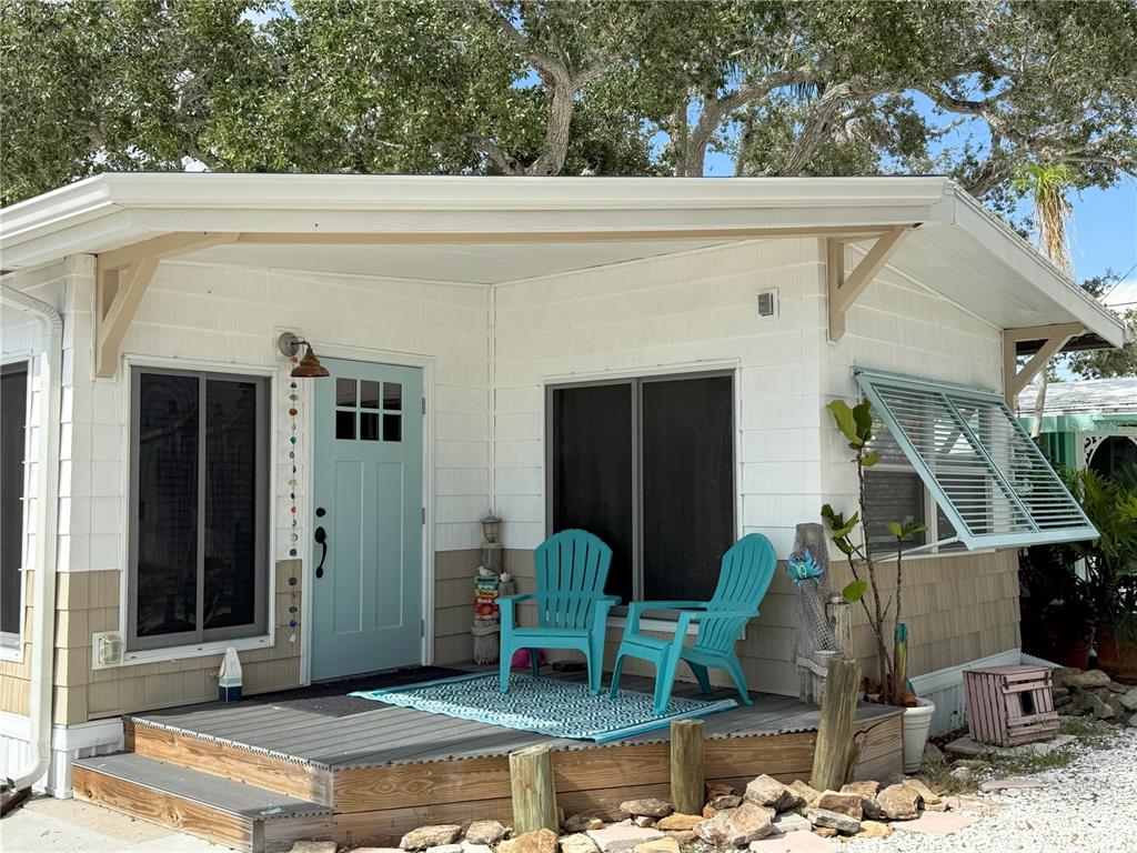 12507 Cortez Road West, Unit 19 Cortez, FL 34215 - Photo 2 of 31 a front view of a house with garden