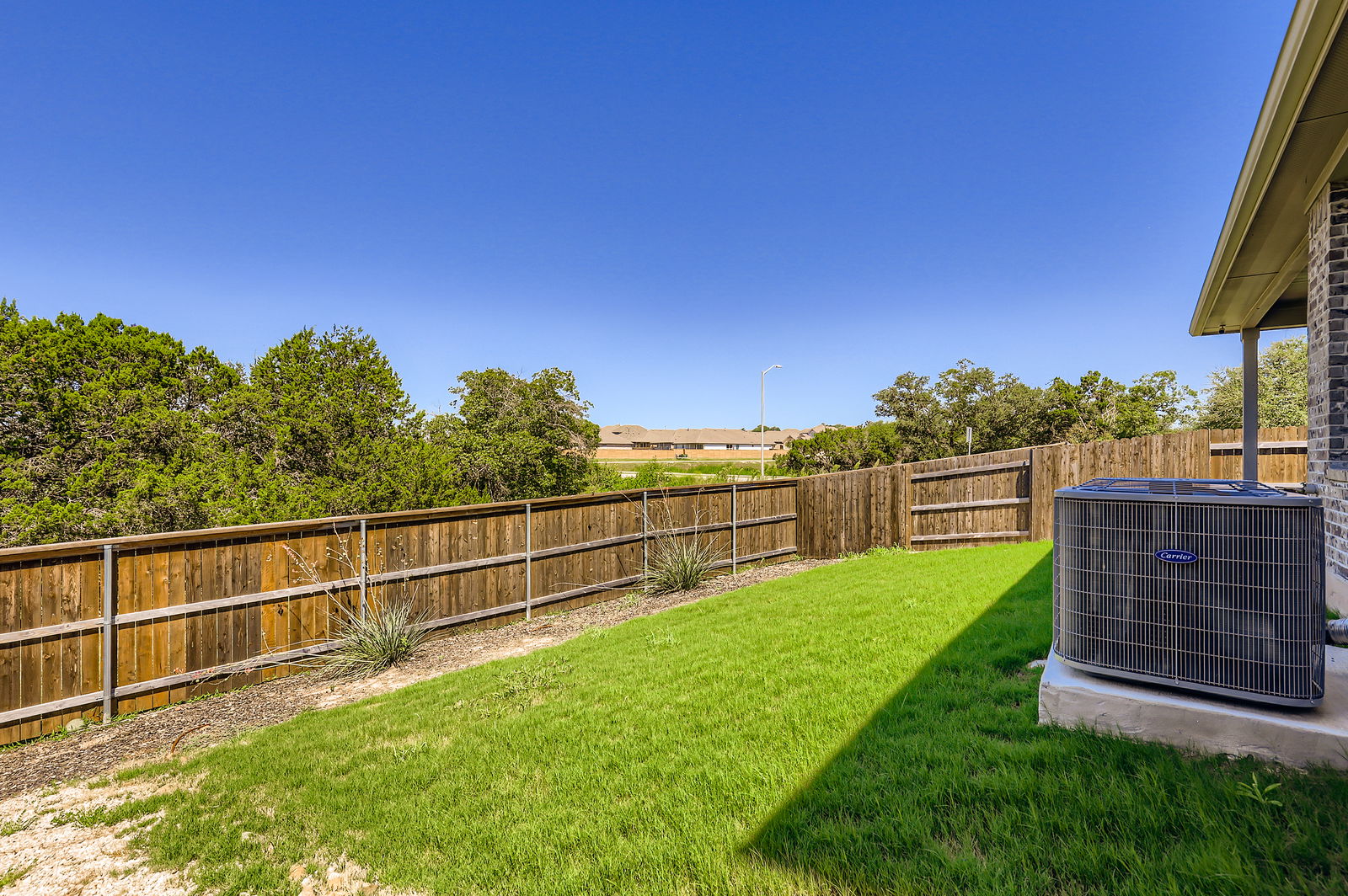 1909 Ruger Pass Leander, TX 78641 - Photo 25 of 31 View of fenced backyard
