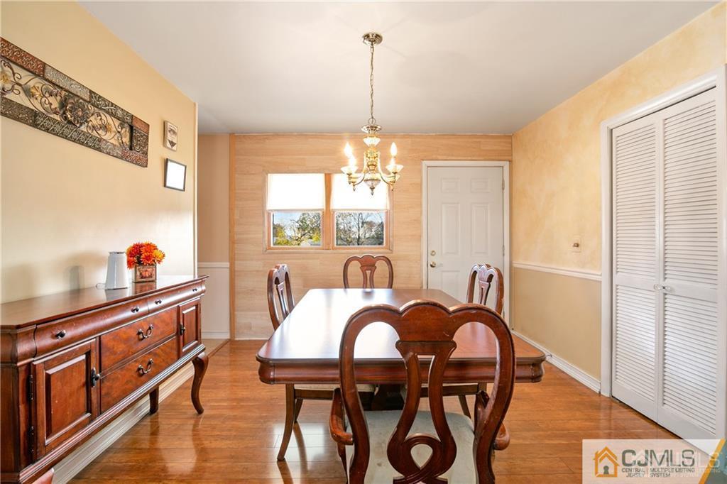 7 Columbia Road Old Bridge, NJ 08859 - Photo 11 of 25 a view of a dining room with furniture window and wooden floor