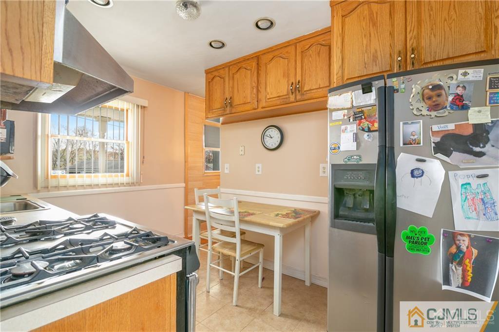 7 Columbia Road Old Bridge, NJ 08859 - Photo 12 of 25 a kitchen with stainless steel appliances granite countertop a stove and a refrigerator