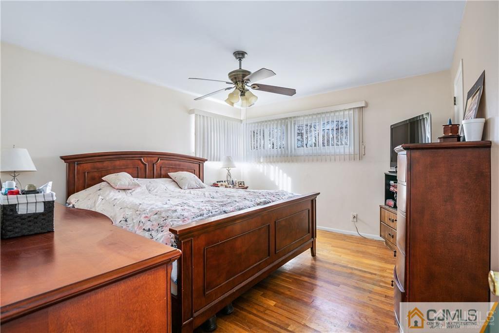 7 Columbia Road Old Bridge, NJ 08859 - Photo 17 of 25 a bedroom with a bed and wooden floor