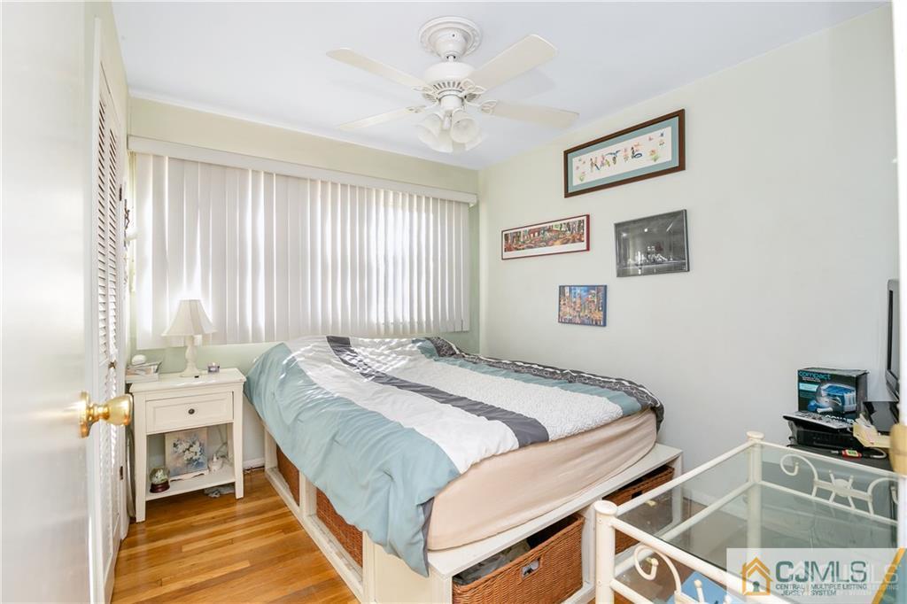 7 Columbia Road Old Bridge, NJ 08859 - Photo 18 of 25 a bed sitting in a bedroom next to a window