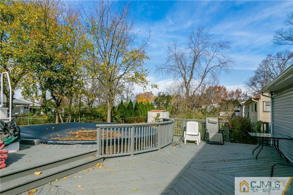 7 Columbia Road Old Bridge, NJ 08859 - Photo 23 of 25 a view of a roof deck with couches and wooden fence