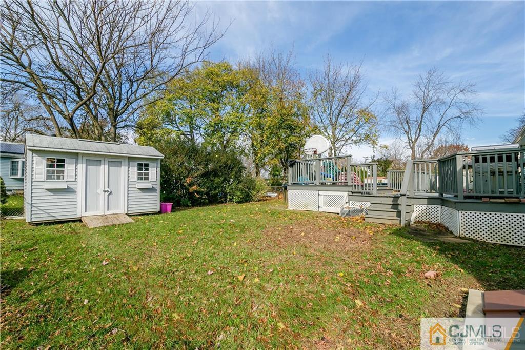 7 Columbia Road Old Bridge, NJ 08859 - Photo 25 of 25 a view of house with yard and trees in the background