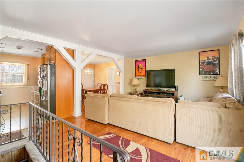 7 Columbia Road Old Bridge, NJ 08859 - Photo 8 of 25 a view of a livingroom with furniture and a flat screen tv