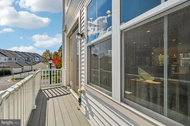 a picture of a bench in front of a wall