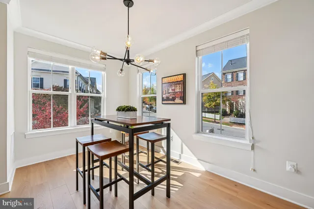 a large kitchen with kitchen island a sink appliances and a counter space