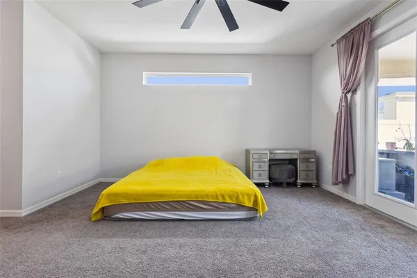 a room with a bed and a chandelier