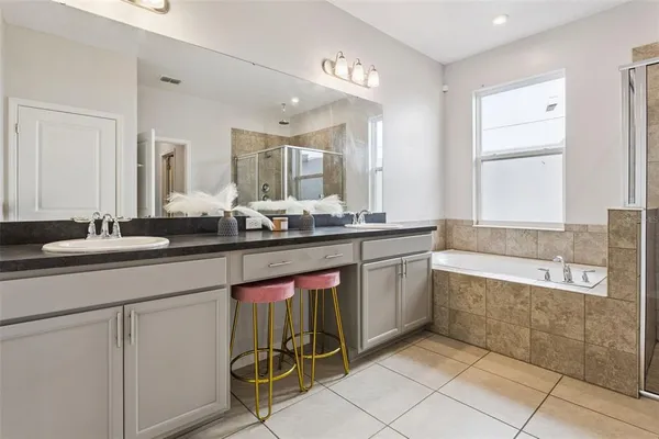 a workspace with a computer on a desk and chair