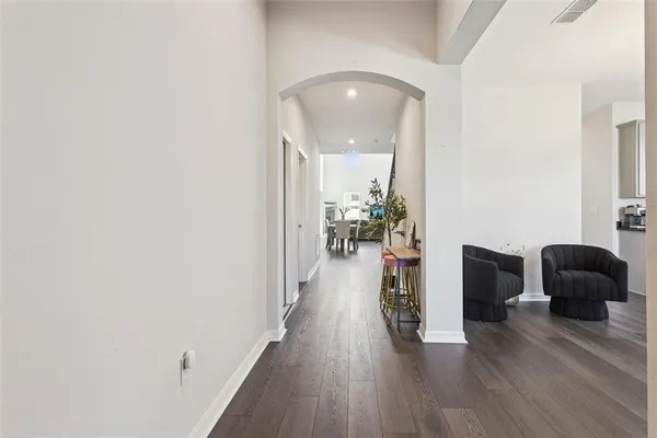a view of a livingroom with furniture and wooden floor