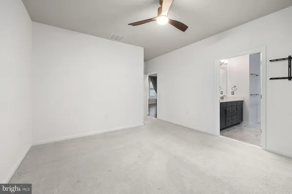 an empty room with a kitchen