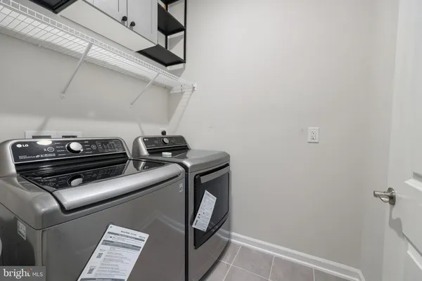 a view of storage and utility room with racks on the wall