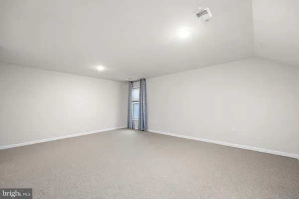 an empty room with a natural light