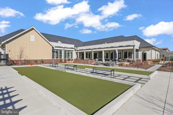 a view of a lake with houses in the background