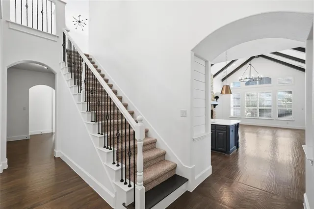 a view of staircase with white walls and windows
