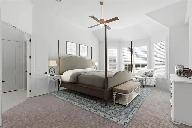 a spacious bedroom with a bed a window and walk in closet