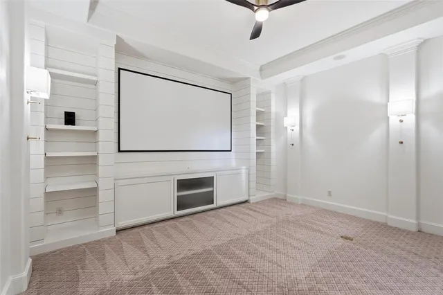 an empty room with closet and windows