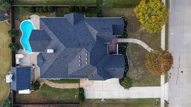 an aerial view of houses with outdoor space