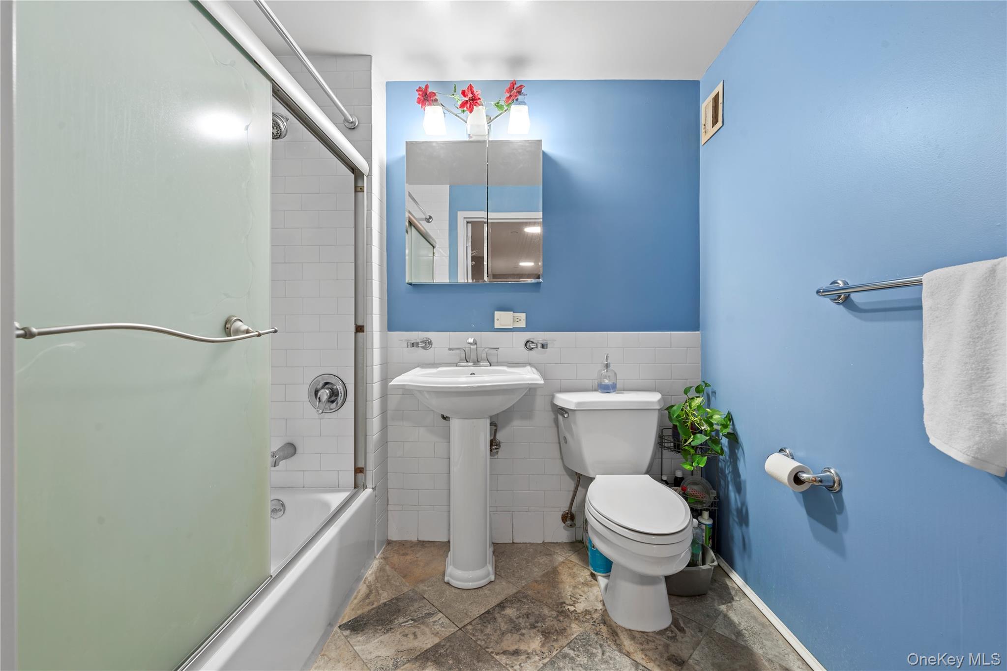 3044 3rd Avenue, Unit 6D Bronx, NY 10451 - Photo 13 of 19 a bathroom with a sink toilet and shower