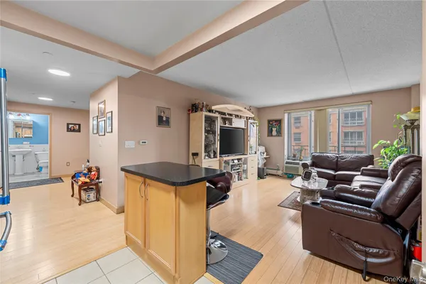 a kitchen with stainless steel appliances granite countertop a refrigerator a stove and a sink with cabinets