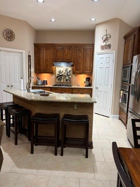 202 Tower Circle Terrell, TX 75160 - Photo 12 of 39 a kitchen with stainless steel appliances granite countertop a stove a refrigerator and a dining table
