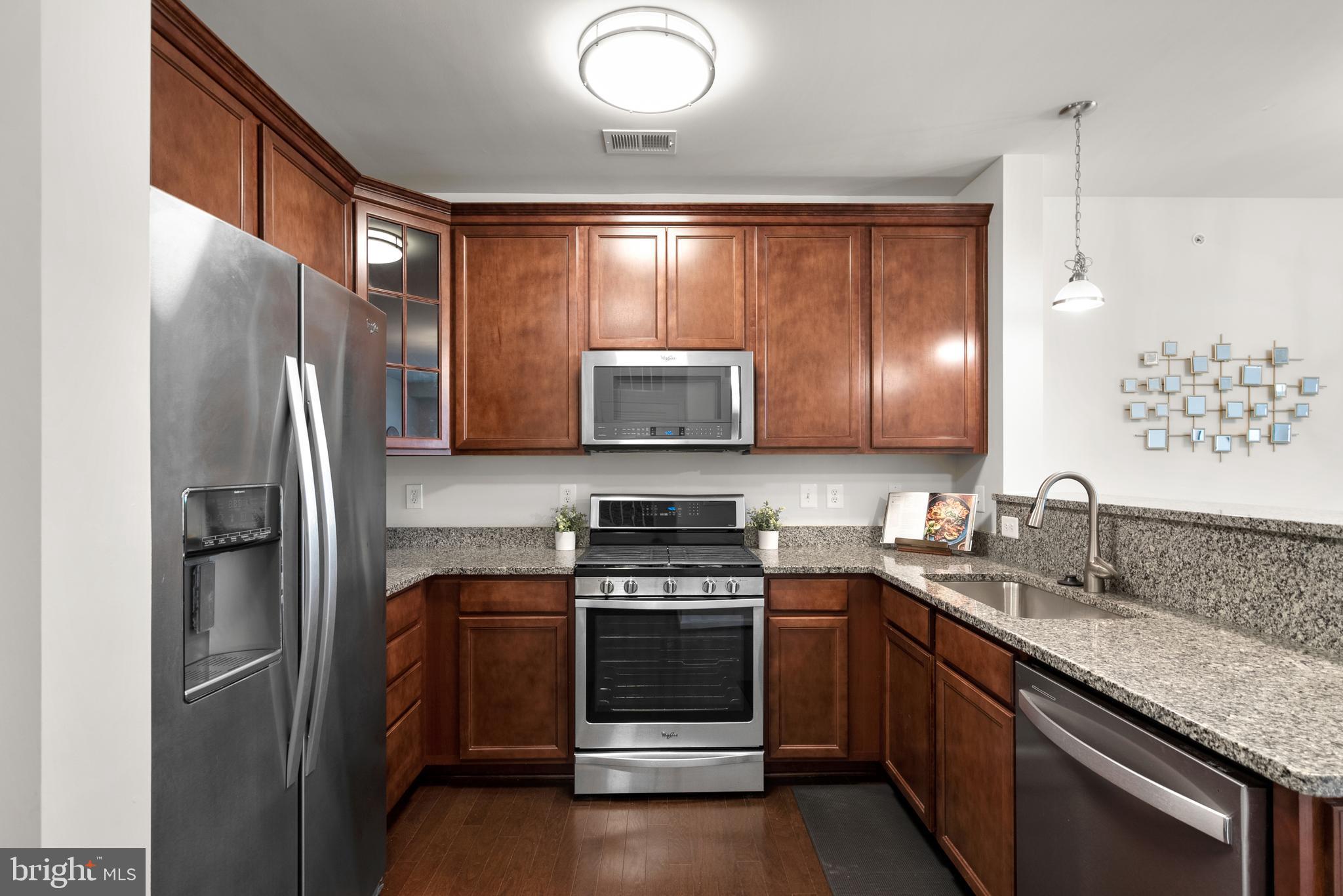 3835 Doc Berlin Drive, Unit 44 Silver Spring, MD 20906 - Photo 13 of 28 a kitchen with a refrigerator sink and stove